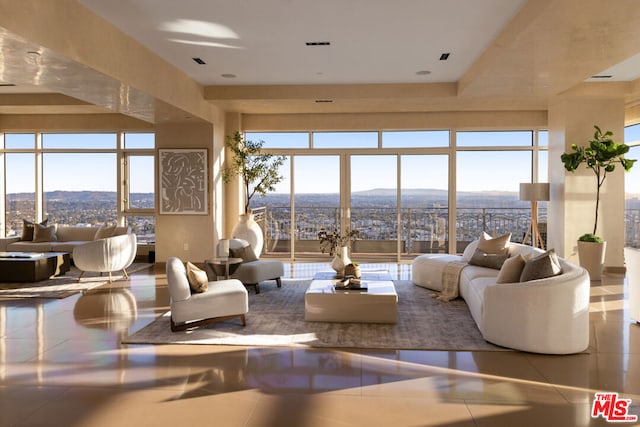 tiled living room featuring a mountain view and plenty of natural light