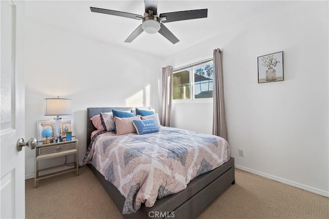 bedroom featuring ceiling fan and light carpet