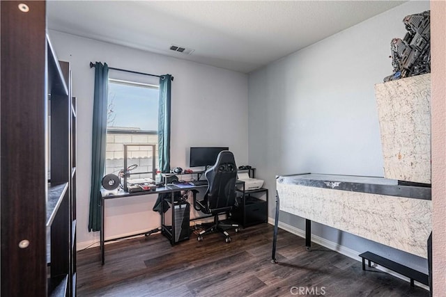 office space with dark hardwood / wood-style flooring