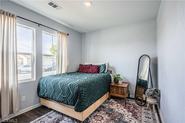 bedroom with wood-type flooring