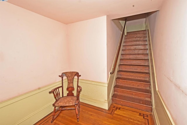 stairway featuring hardwood / wood-style floors