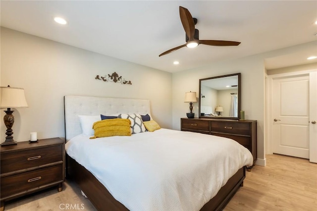 bedroom featuring light hardwood / wood-style flooring and ceiling fan