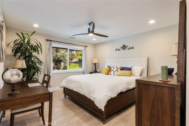 bedroom featuring light hardwood / wood-style flooring and ceiling fan