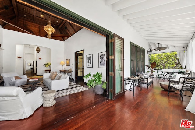 living room featuring ceiling fan, wood-type flooring, lofted ceiling with beams, and wooden ceiling