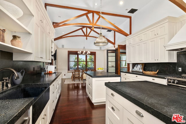 kitchen with pendant lighting, white cabinetry, backsplash, a chandelier, and dark wood-type flooring