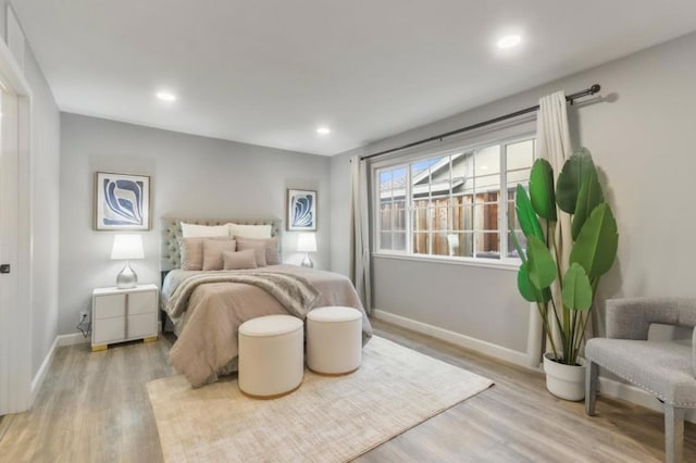 bedroom with light hardwood / wood-style floors