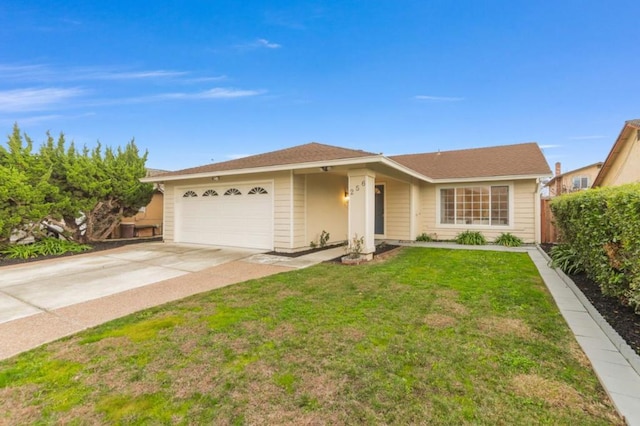 ranch-style home with a garage and a front lawn