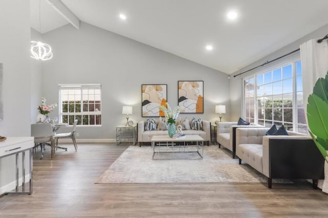 living room with beamed ceiling, hardwood / wood-style floors, and high vaulted ceiling