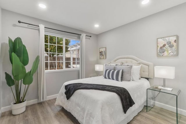 bedroom with wood-type flooring