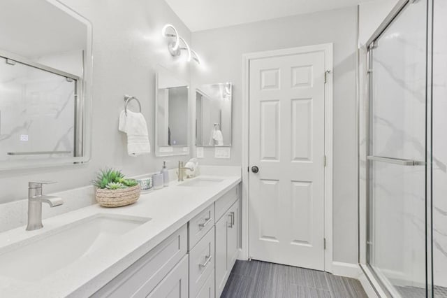 bathroom featuring an enclosed shower and vanity