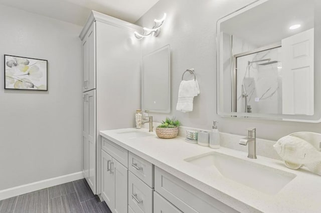 bathroom featuring vanity and an enclosed shower