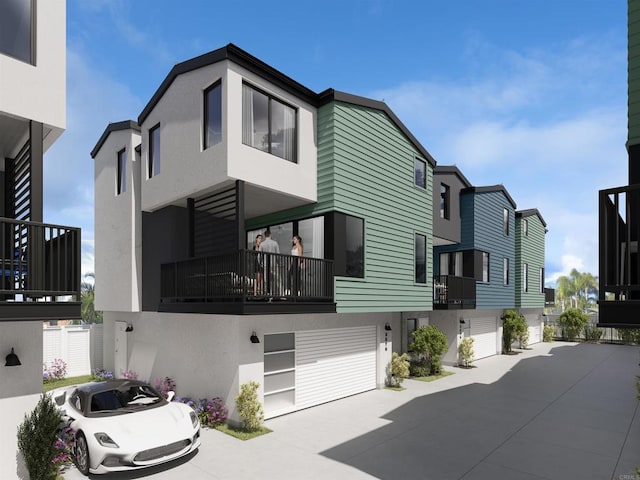 view of front facade with a garage and a balcony