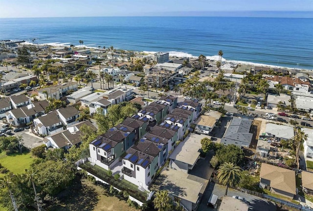 drone / aerial view with a residential view and a water view