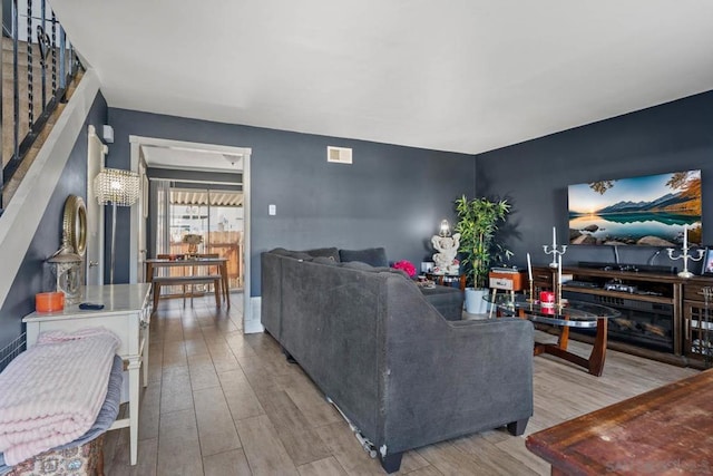 living room with light hardwood / wood-style flooring