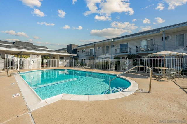 view of swimming pool featuring a patio area