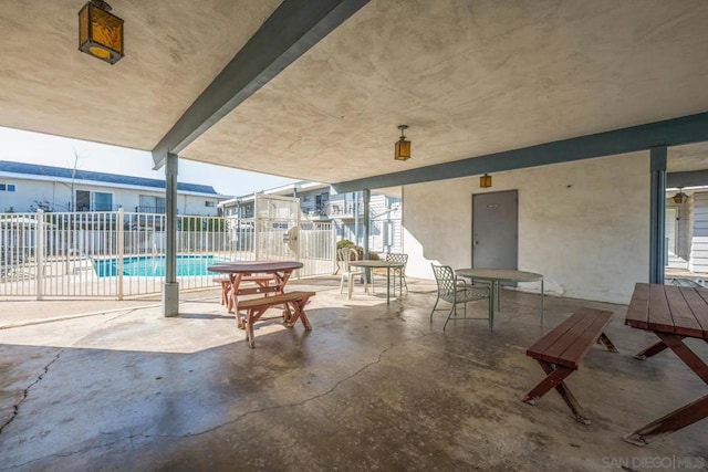 view of patio with a community pool