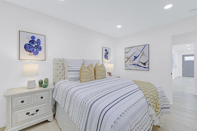 bedroom with light wood-type flooring