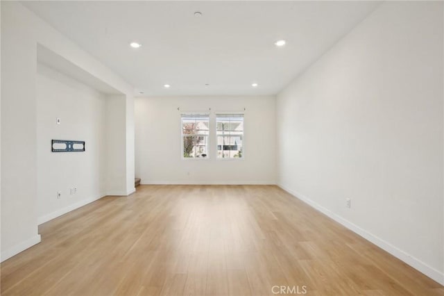 spare room featuring light wood-type flooring