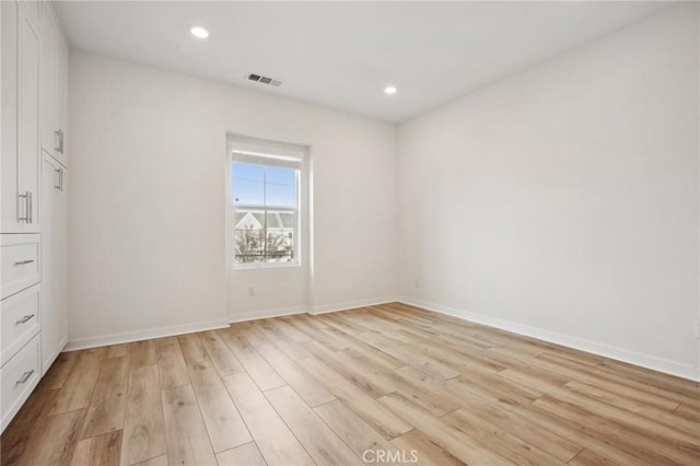 unfurnished room featuring light hardwood / wood-style flooring