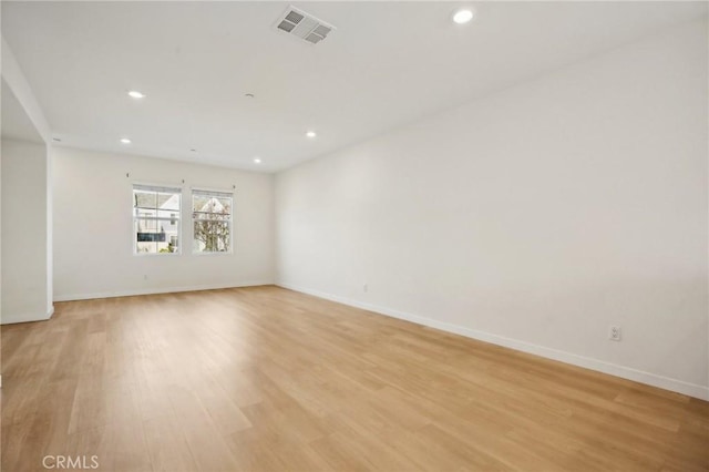 unfurnished room featuring light hardwood / wood-style floors