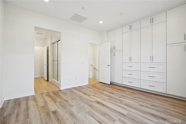 unfurnished bedroom with light hardwood / wood-style flooring