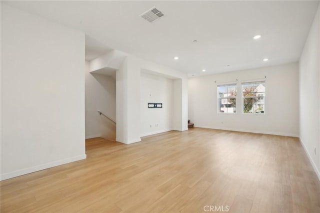 unfurnished living room with light hardwood / wood-style floors