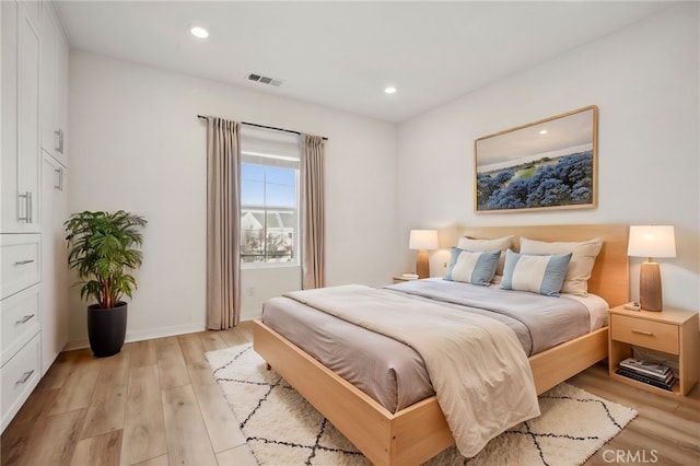 bedroom featuring light hardwood / wood-style floors