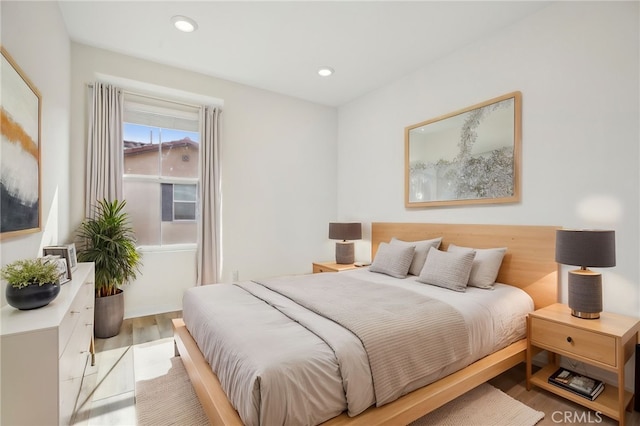 bedroom with light hardwood / wood-style floors