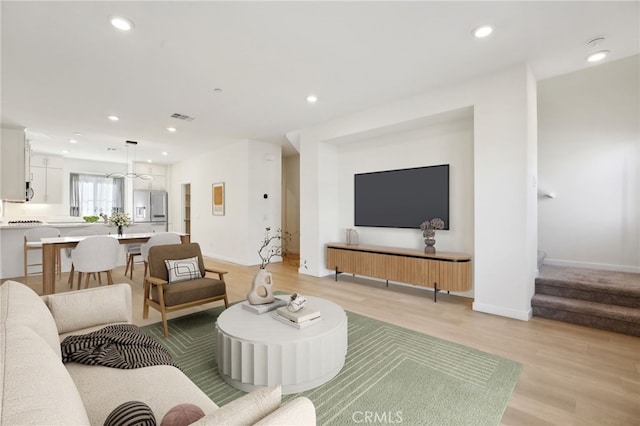 living room with light hardwood / wood-style flooring