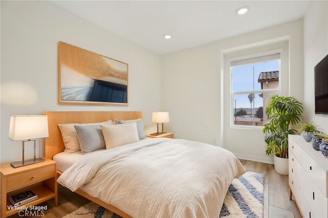 bedroom featuring light hardwood / wood-style floors