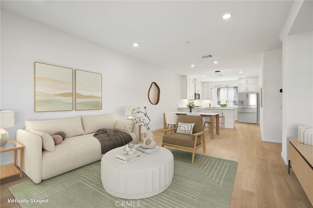 living room featuring light wood-type flooring