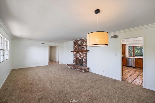 unfurnished living room featuring crown molding, a fireplace, and light colored carpet