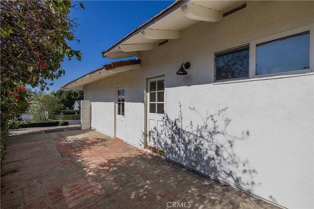 view of side of home featuring a patio area