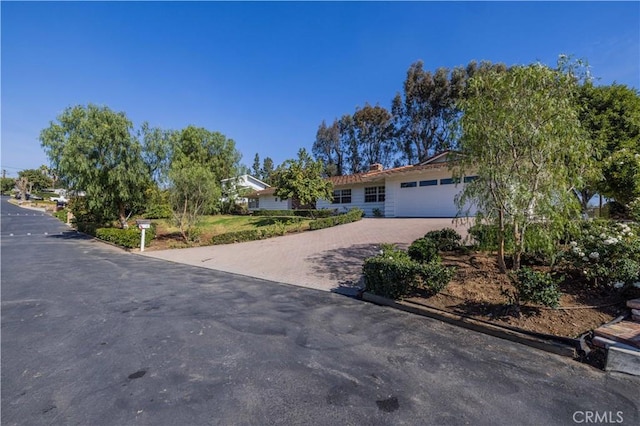 ranch-style home featuring a garage