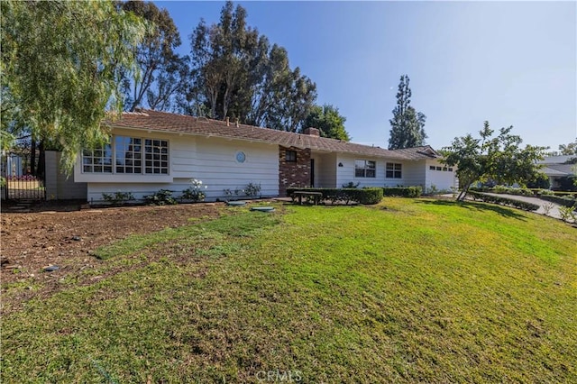 ranch-style house with a front lawn