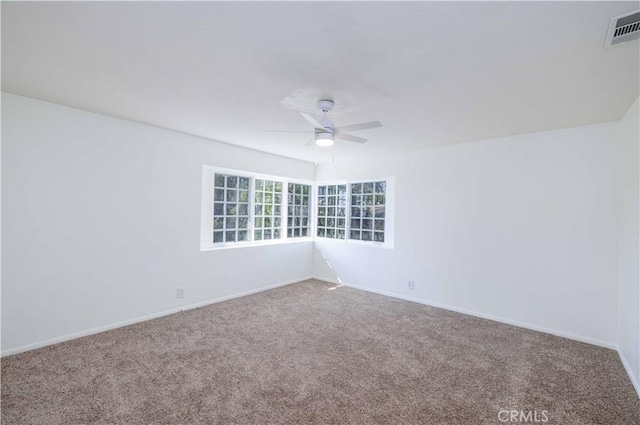 carpeted empty room with ceiling fan