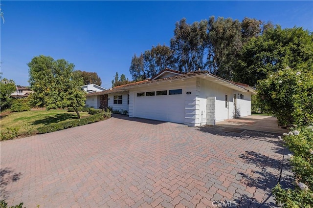 ranch-style house featuring a garage