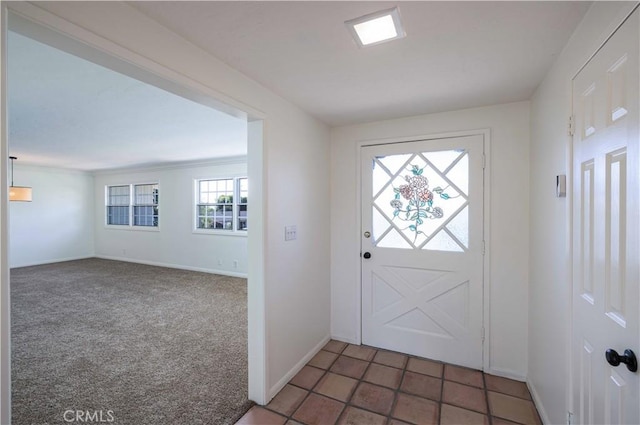 view of carpeted entrance foyer