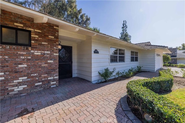 entrance to property with a patio