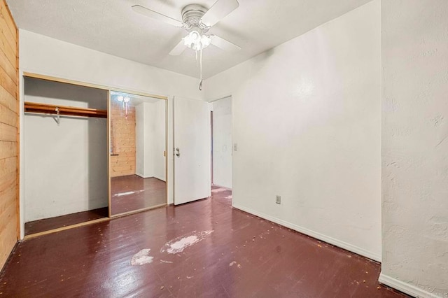 unfurnished bedroom featuring a closet and ceiling fan