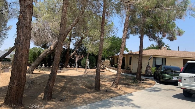 view of side of property with stucco siding