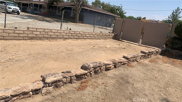 view of yard featuring a gate and fence