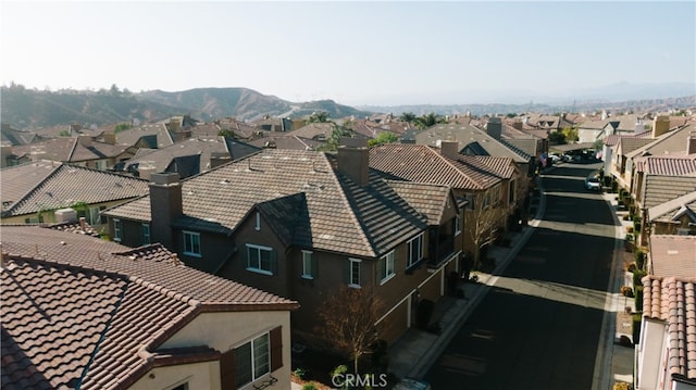 birds eye view of property featuring a mountain view