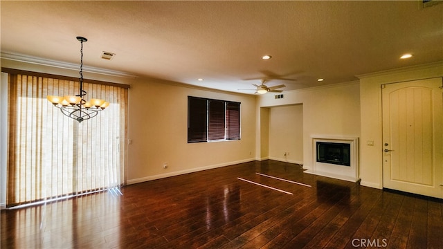 unfurnished living room featuring crown molding, dark wood-type flooring, and ceiling fan with notable chandelier