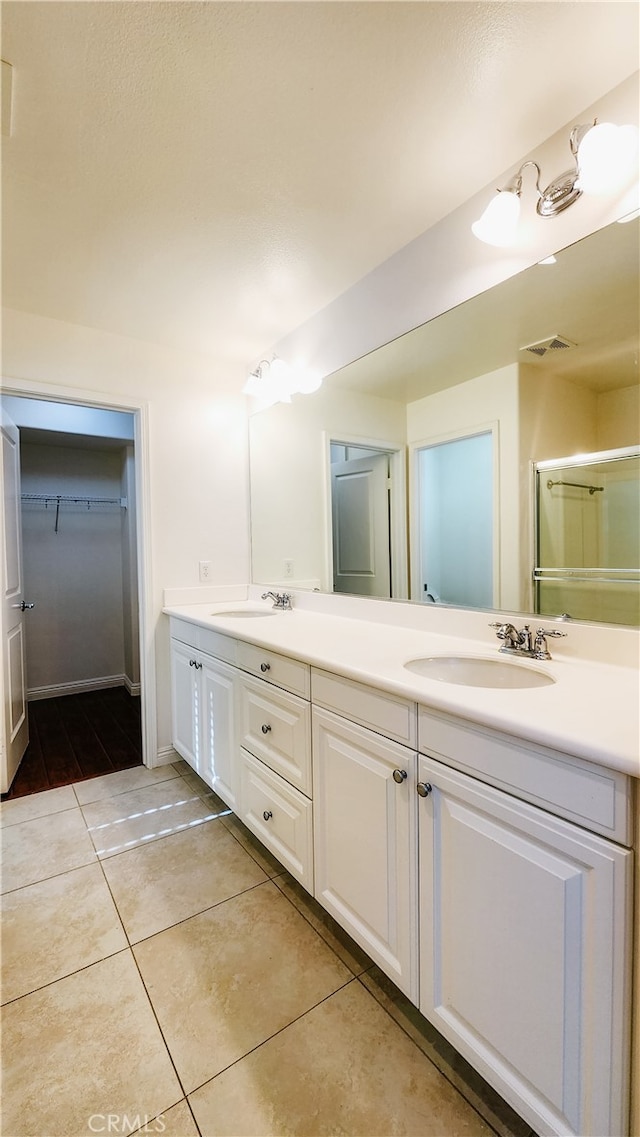 bathroom featuring tile patterned floors and vanity