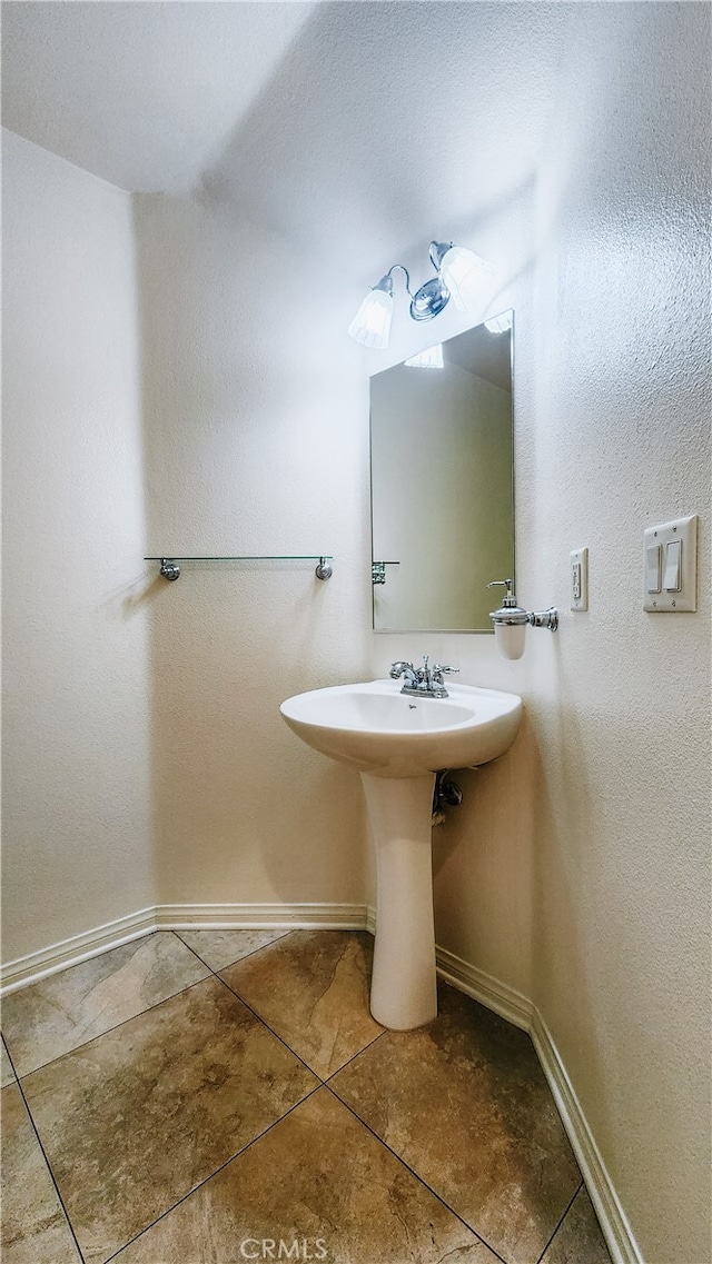 bathroom featuring tile patterned floors and sink