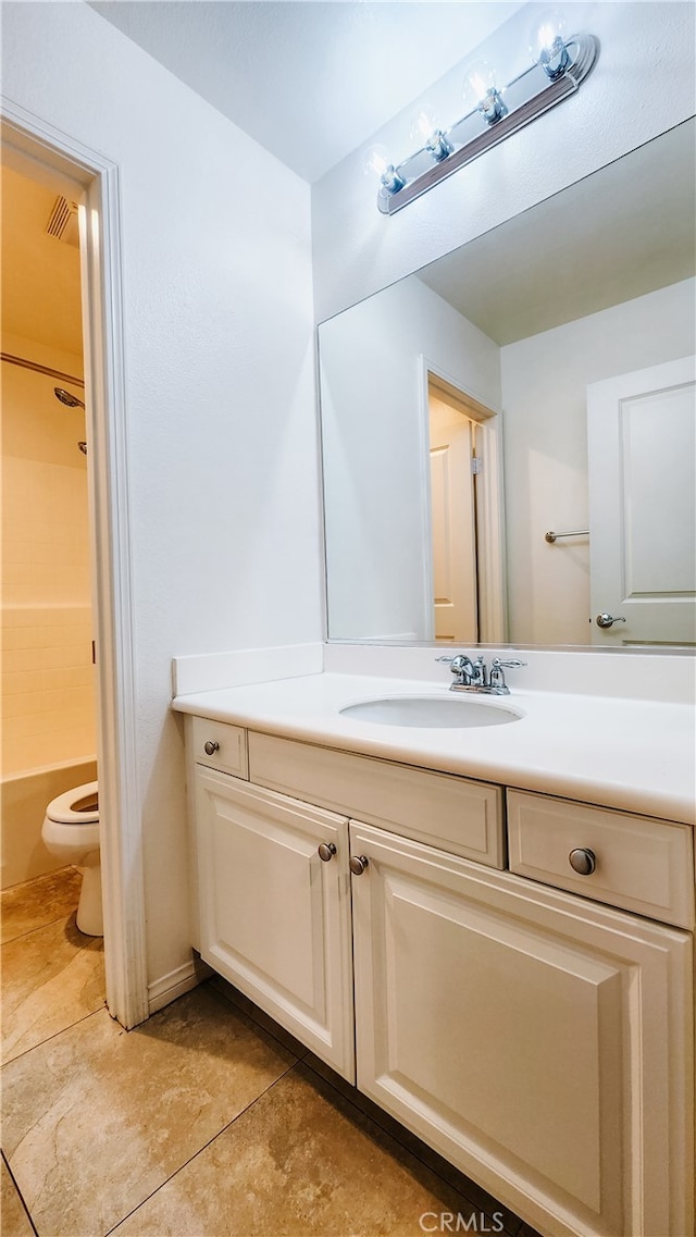 full bathroom with bathtub / shower combination, tile patterned floors, vanity, and toilet