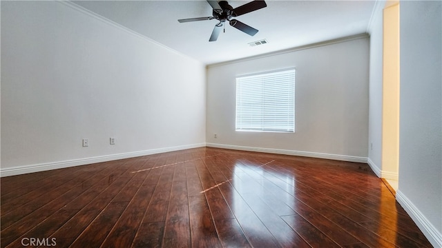 unfurnished room with crown molding, dark hardwood / wood-style floors, and ceiling fan