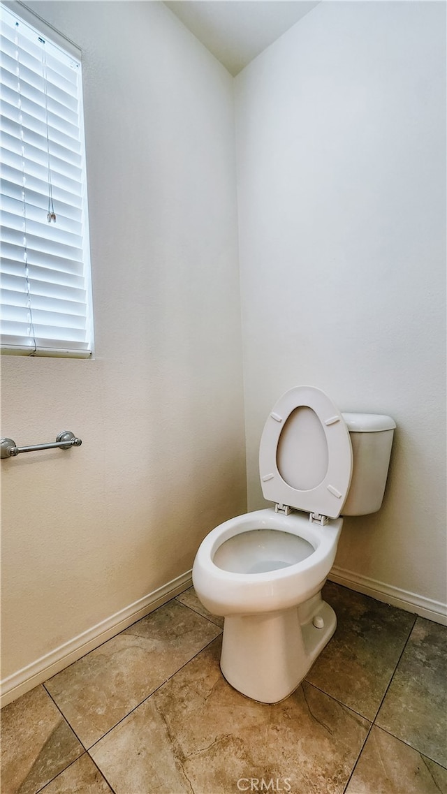 bathroom featuring tile patterned floors and toilet