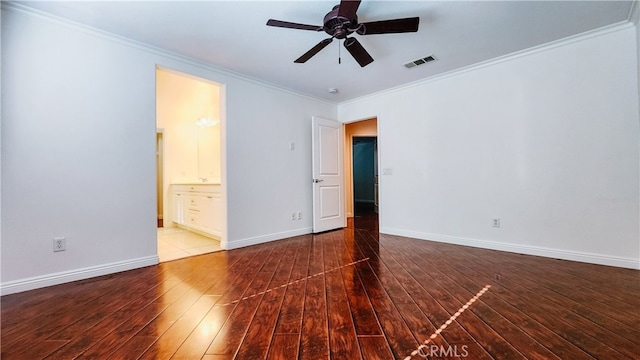 unfurnished bedroom featuring wood-type flooring, ornamental molding, and ensuite bathroom